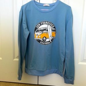 Blue sweater with San Francisco label.
